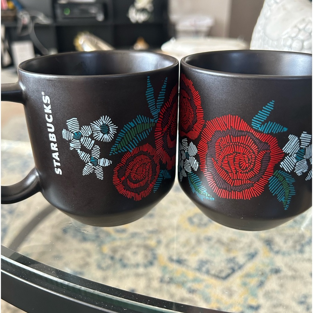 2-10ounce Starbucks coffee cups. Black cups with red rose designs.